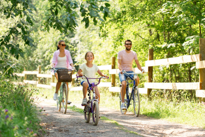 happy-family-riding-bikes-outdoors-mobile