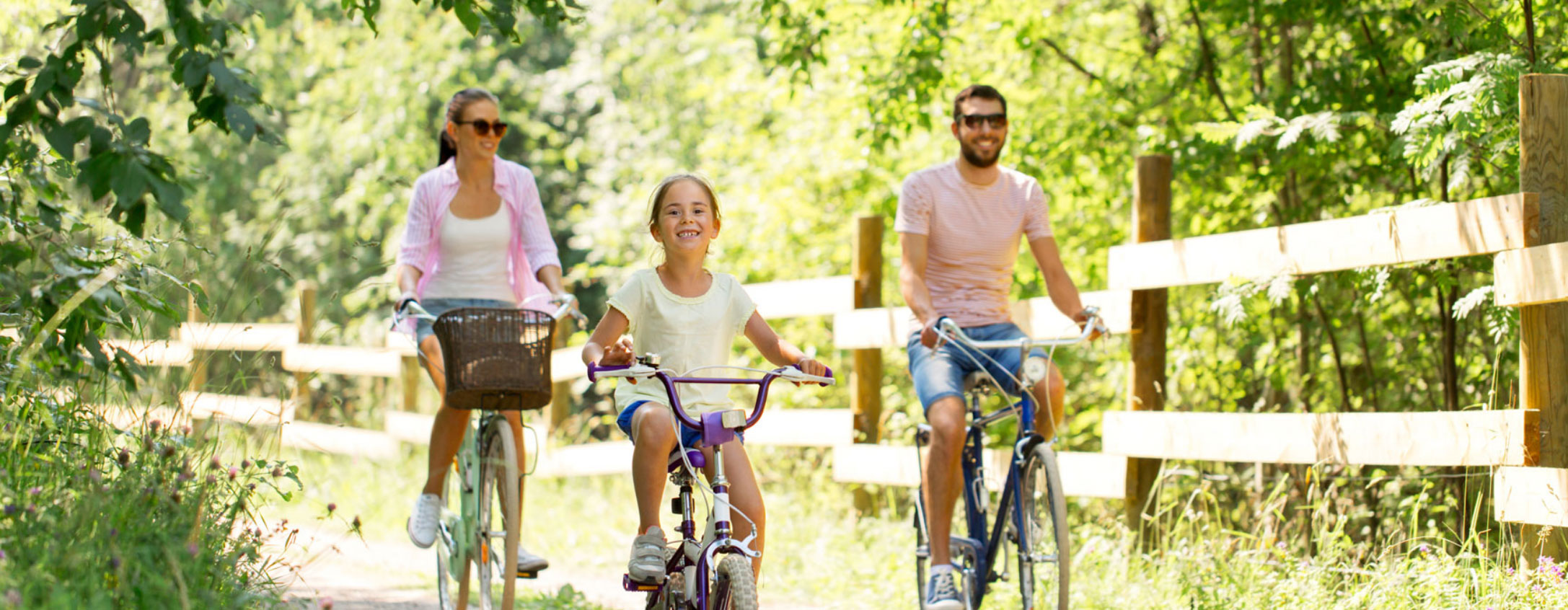 happy-family-riding-bikes-outdoors